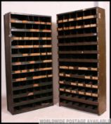 An original mid 20th century Industrial large green enamel metal sectional cubby cabinet.