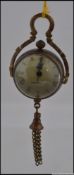 A miniature brass ball clock, having rom