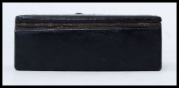 A 19th century papier mache snuff box of