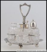 A silver hallmarked cut glass 4 piece cr