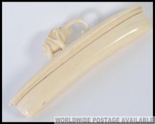 An early 20th century carved Ivory nail