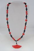 A vintage Art Deco red and black necklac