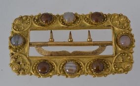 A large Victorian pinchbeck buckle set w