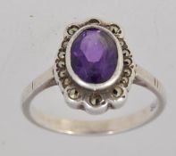 A 925 silver dress ring with central ova