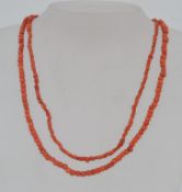 A vintage coral bead necklace with sprin