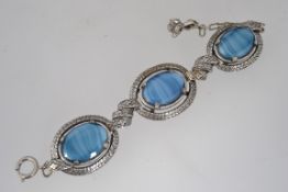 A vintage white metal and blue agate bra