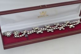 A vintage white metal necklace and earri