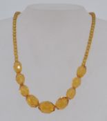 A vintage 1930s faceted amber glass bead
