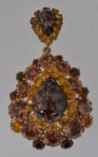 A vintage yellow metal drop pendant broo