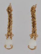 A pair of vintage 10k gold opal drop earings. Marked 10k Mexico. Measures 3cms. Weight 1.9g.