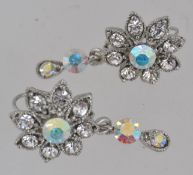 A pair of vintage white metal flower dro