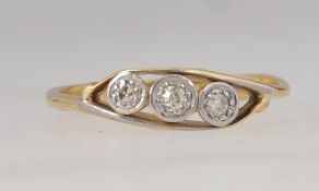 A vintage Art Deco 18ct gold three stone