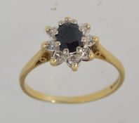 A hallmarked Sheffield 18ct gold sapphir