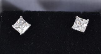 A pair of silver stud earrings