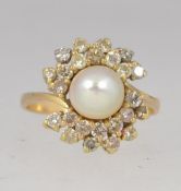 An 18ct gold diamond and pearl ladies cl