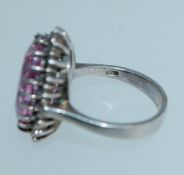 A 925 silver ring set with an oval cut p