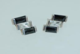 A pair of 925 silver earrings set with C