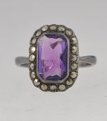 A white metal dress ring set with a cent