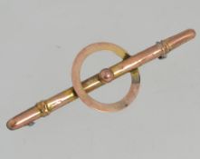 A vintage yellow metal bar brooch with c