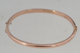 A vintage hallmarked 9ct gold bangle bracelet with clip clasp hallmarked for Birmingham Joseph