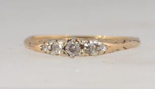 An 18ct gold ring set with 5 diamonds in