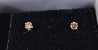 A pair of 14ct white gold champagne diam