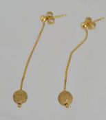 A pair of 375 9ct gold drop earrings with planished ball finials. Marked with CCM mark 375.