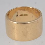 A hallmarked 9ct gold plain wide band ri