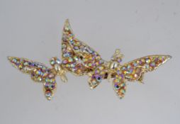 A vintage yellow metal brooch in the for