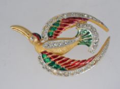 A vintage yellow metal enamelled brooch