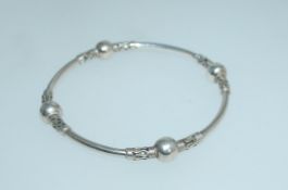 A 925 silver bangle with balanese and ba