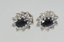 A pair of hallmarked 9ct gold earrings w