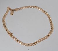 A 9ct gold curb link bracelet with lobster claw clasp. Weight 2.6g. Measures 10cms.