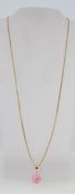 A pink shambala drop pendant necklace on