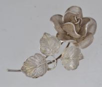 A large filigree rose brooch pin with ro