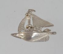 A vintage silver sailing boat charm pend
