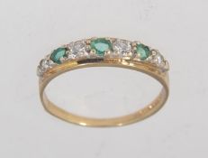 A hallmarked London 9ct gold with green