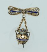 A vintage yellow metal filigree and enam