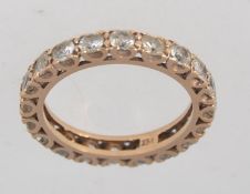 A tested 9ct gold full eternity ring wit