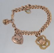 An 9ct gold antique watch chain strung with a 9ct gold front & back heart shaped locket together