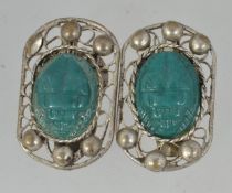 A pair of vintage white metal clip on ea