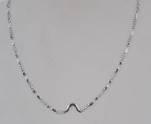 An 18ct white gold and blue diamond ladi