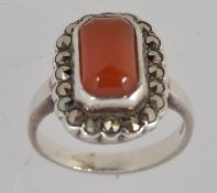 A silver dress ring with central carneli