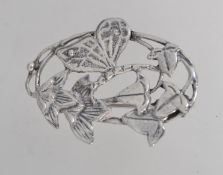 A silver Art Nouveau style brooch with a