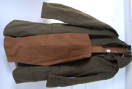 UNIFORM: A WWII Second World War British uniform great coat, along with a pair of leg breeches.