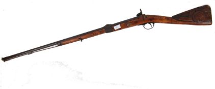 MUSKET RIFLE: A mid-19th century full length musket rifle. With carved decorative butt.