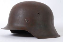 SS HELMET: A Second World War WWII issue 1942 pattern single-decal uniform SS Nazi Helmet.