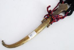 DAGGER; An Indian brass curved blade dagger, with brass scabbard, and rope and braid strung handle.