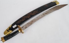 SWORD: A large Chinese oriental sword in original scabbard.