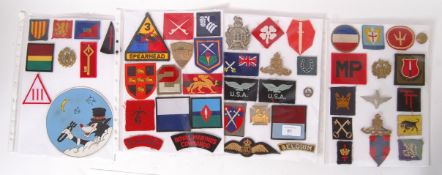 PATCHES & BADGES: A good collection of British military and uniform cap badges and cloth formation